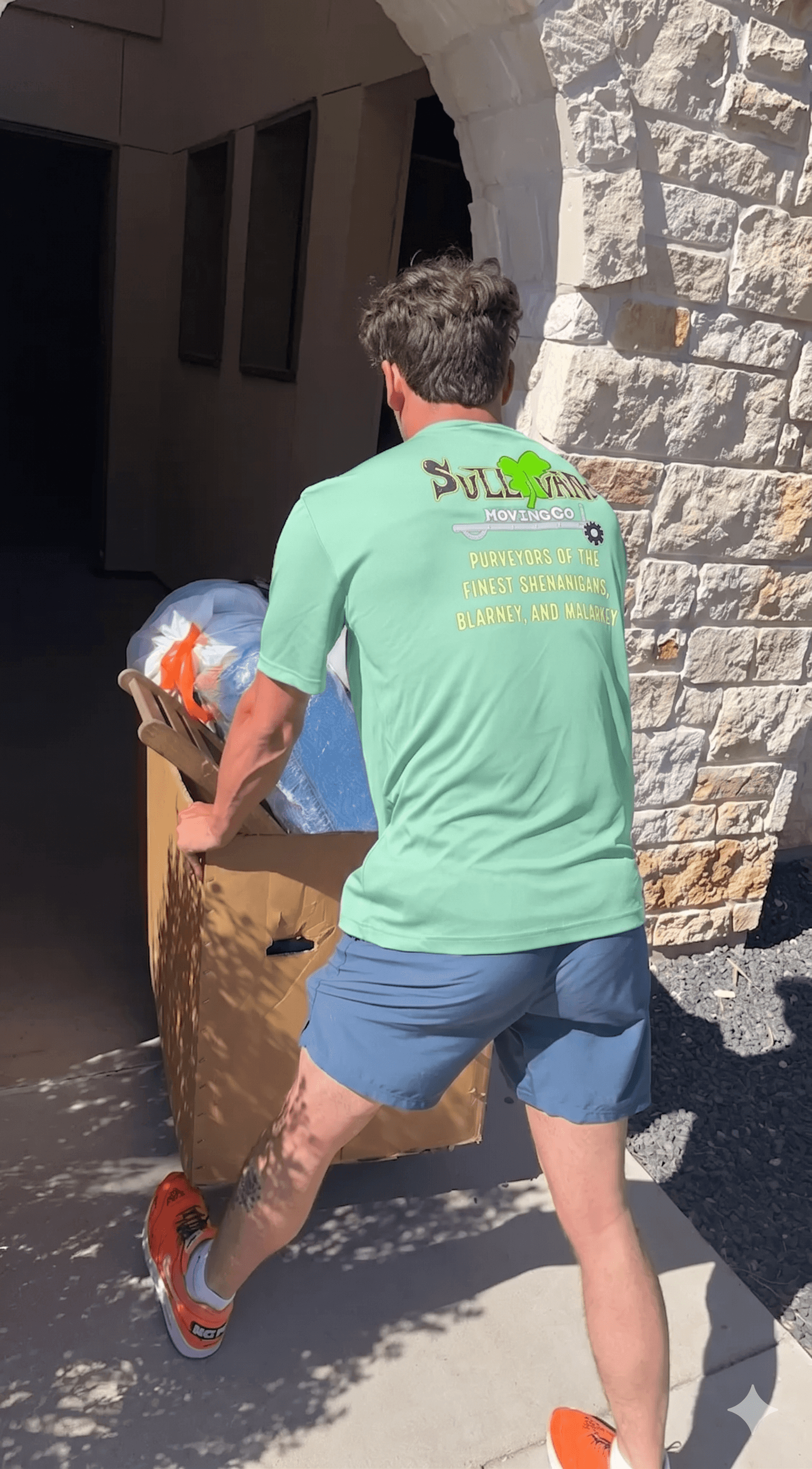 Sullivan Moving team member carrying furniture