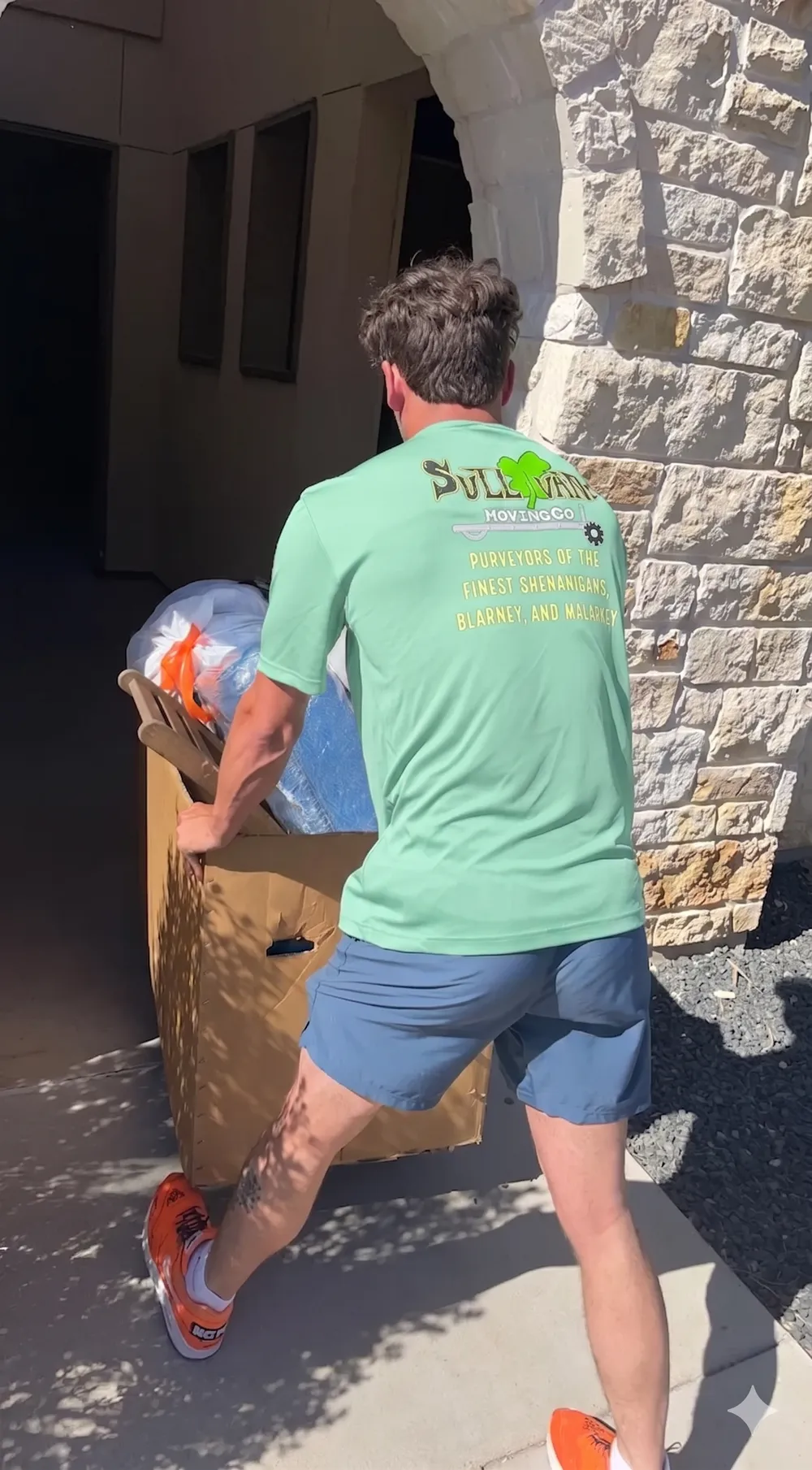 Sullivan Moving team member carrying furniture